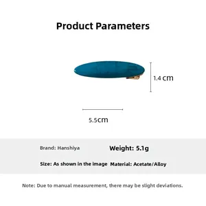 Detail view of blue marble acetate hair clip measuring 5.5cm by 1.4cm with alloy base