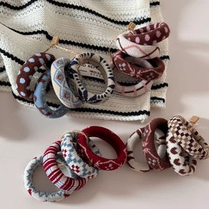 Close-up of jacquard hair ties with knitting textures and colorful patterns