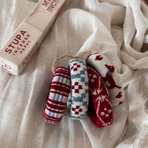 Detail view of four jacquard fabric hair ties with bohemian ethnic patterns and textures