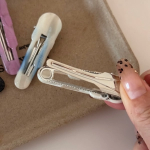 Detail of marble pattern acetate hair clips with durable metal spring design