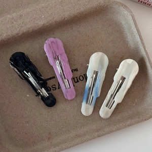 Elegant 4-piece acetate hair clip set in marble black, lavender, blue, and cream colors