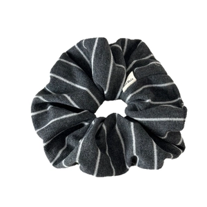 Dark gray striped knit oversized scrunchie with a minimalist Hand Made label