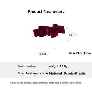 Detailed view of large burgundy suede bow banana clip with dimensions 15.5cm by 5.5cm