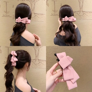 Elegant multi-layered pink suede bow banana clip for women shown in lifestyle views