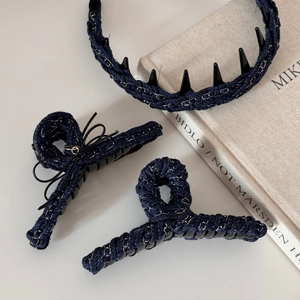 Detail of dark blue denim chain hair clips and headband set for elegant styling