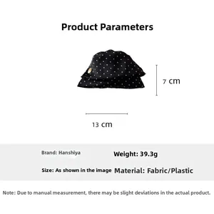 Vue détaillée du nœud à pois pour cheveux avec dimensions 13 cm de large et 7 cm de haut
