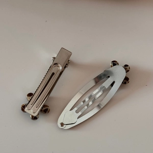 Rear view of silver metal hair clips with leopard print acetate pattern and spring buckle