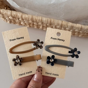 Retro leopard print hair clips set with rhinestone flowers in oval and rectangle shapes