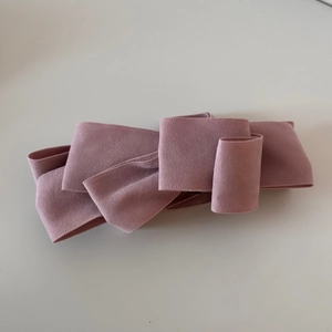 Detailed top view of the layered velvet pink bow clip with premium matte texture finish