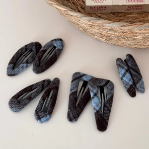 Detailed set of blue and brown plaid fabric hair clips in various geometric shapes