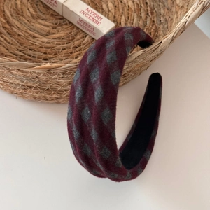 Detail of vintage thick sponge headband with burgundy and grey diamond check fabric