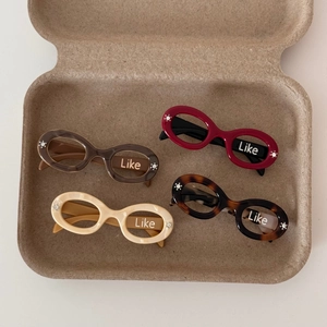 Set of four small acetate sunglasses hair clips with rhinestones in various warm tones