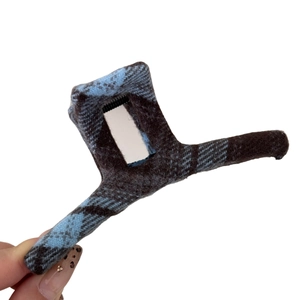 Blue plaid fabric hair claw clip with checkered pattern and fuzzy wool texture