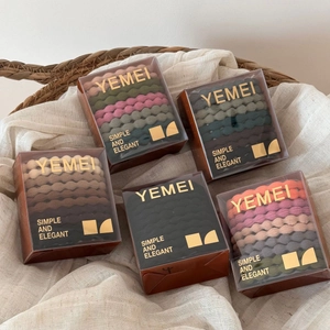 Five boxes of thick wavy elastic hair bands in assorted Morandi and earth tone colors