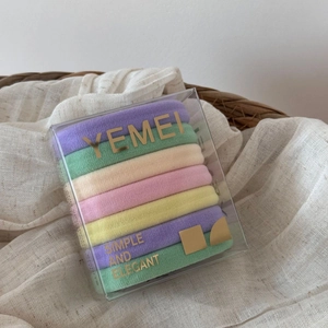 Detail view of 7-piece high elasticity seamless hair ties in macaron colors and gift box