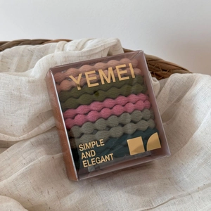 Close-up of eight high-elasticity hair ties in Morandi colors inside a premium gift box