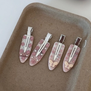 Barrettes à cheveux en acétate rose avec fleurs en cristal et papillons sur plateau