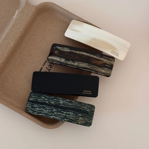 Detailed set of four handmade rectangle acetate hair clips in classic marble textures