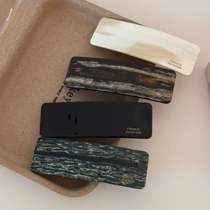Rectangular acetate hair clip set in cream, tortoiseshell, black and grey marble colors