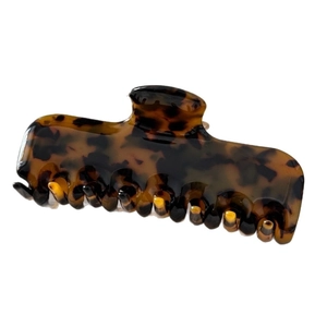 Classic tortoiseshell claw clip in amber brown acetate for women with thick hair