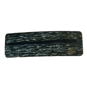 Rectangular marble acetate barrette with gold label for elegant hair styling