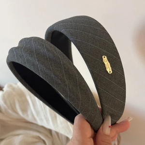 Gray striped padded headband with handmade metal tag for high skull top hair style