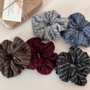Five-pack of striped knitted scrunchies in grey, blue, brown, red and black colors