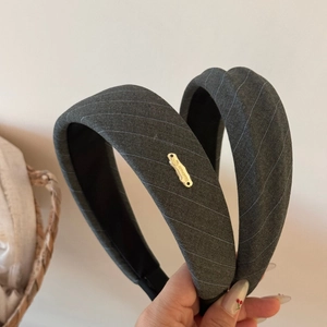 Minimalist dark gray twill padded headband with handmade gold tag for high crown look