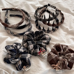 Detail of vintage plaid fabric headbands and scrunchies with handmade labels and bows