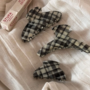 Three-piece set of black and white plaid acetate hair claws in various sizes and shapes