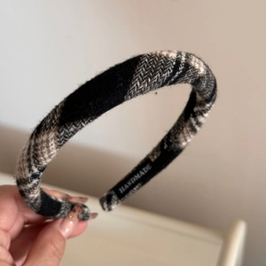 Detail showing the plaid fabric texture and Handmade label on a non-slip headband