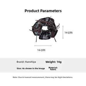 Detail showing retro blue and brown plaid fabric scrunchie with a 14cm diameter size