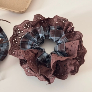 Detailed close-up of retro plaid hair scrunchie with brown embroidery lace trim