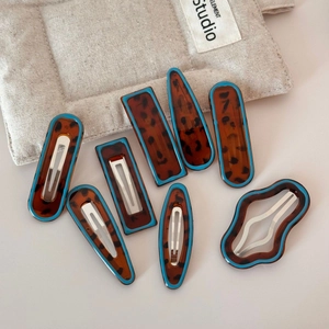 Detailed set of 8 tortoiseshell hair clips with blue edges and silver metal springs
