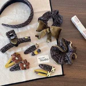Detailed set of brown plaid hair clips with cute velvet bear and green bow hair accessories
