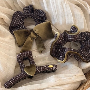 Detailed set of brown plaid and olive green velvet hair accessories with bow and heart clip