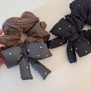 Detailed macro view of knit fabric texture on polka dot bow hair scrunchies