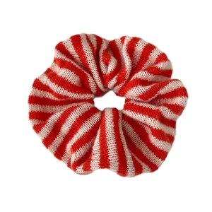 Oversized knitted scrunchie with bold red and pink vertical stripes for autumn