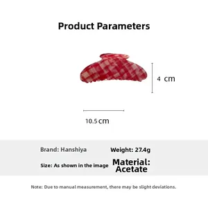 Macro detail of red plaid acetate hair claw clip showing size dimensions 10.5cm x 4cm