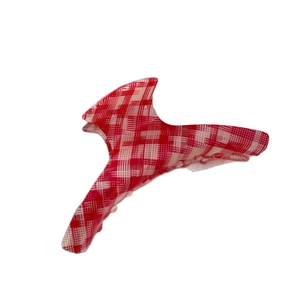 Elegant red and white checkered acetate claw clip with curved hair clamp design