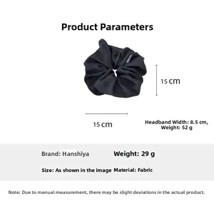Detailed view of 15cm oversized black pleated fabric scrunchie with size and weight info