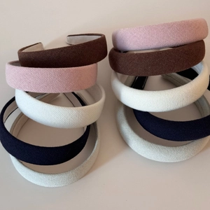 Set of padded sponge headbands in five neutral colors with knit textured fabric