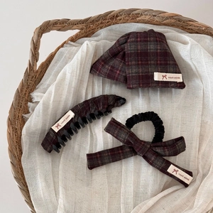 Three-piece dark plaid hair accessories set featuring handmade bow hair clips and scrunchie