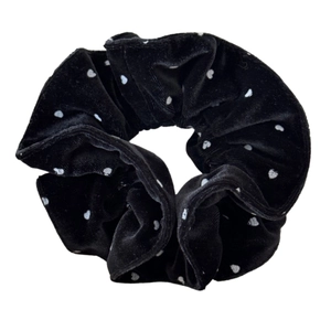 Elegant black velvet polka dot scrunchie with soft heart patterns for high-end hair styling