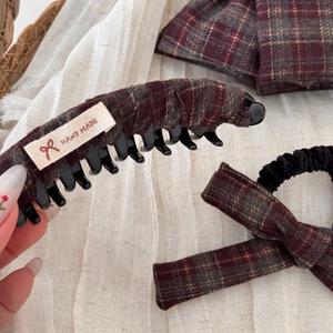 Detail view of handmade plaid bow banana clip and scrunchie set in vintage British style