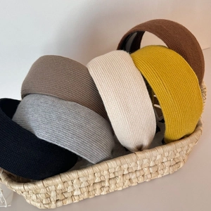 Detail showing knitted texture and internal non-slip teeth on wide headbands