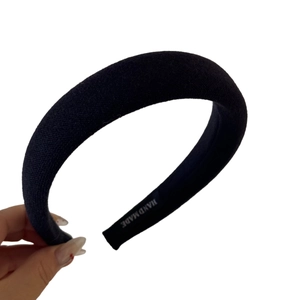 Classic black padded sponge headband with handmade knit texture for volume styling