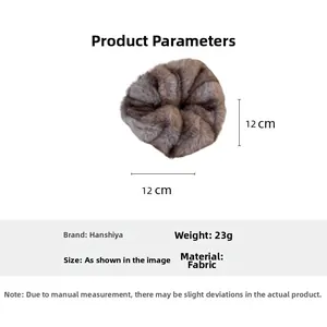 Detail showing 12cm faux fur scrunchie dimensions and 23g weight in brownish grey fabric