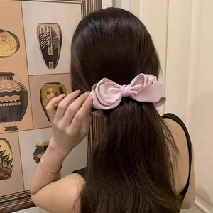 Pink satin bow banana hair clip for women featuring elegant silk style non-slip design