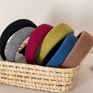 Detailed texture of colorful padded wool headbands in various rich autumn shades